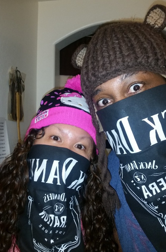 picture of sehana with husband acting goofy, they don't actually drink though. the jack daniels bandana was a gift from their sister.